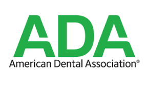 Logo of the American Dental Association with green letters ADA.